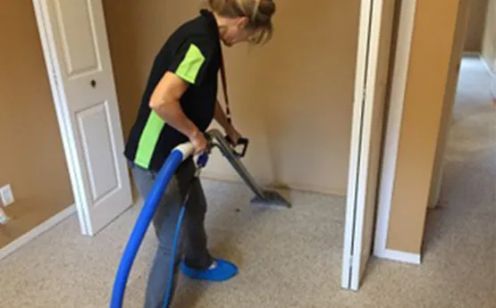 Eco Choice team member carefully treating a carpet