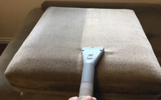 Professional upholstery cleaning on a fabric ottoman